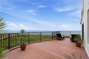 Expansive private terrace showcases sweeping unobstructed views of the Atlantic Ocean.