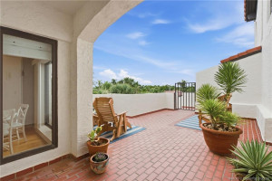 Large open-air courtyard with multiple seating areas and tropical landscaping.