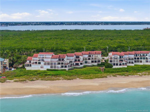Stunning aerial view of The Dune along the Atlantic shoreline, surrounded by natural coastal landscape with the Indian River beyond.
