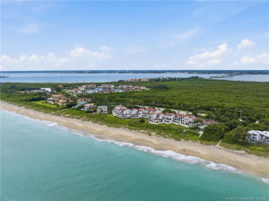 Sweeping aerial view captures the Atlantic shoreline, The Dune, and the Indian River beyond.