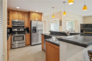 Photo for 1800 SE Saint Lucie Boulevard 9-105, Stuart, FL 34996 - listing #M20057220 One of a kind kitchen island with sink and dishwasher attached allowing for easy entertaining.