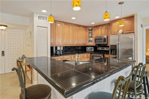 L shaped granite island easily sits 5