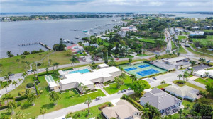 Aerial view of clubhouse and entrance across from the St. Lucie River