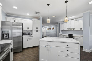 Quartz counters and island with waterfall edge