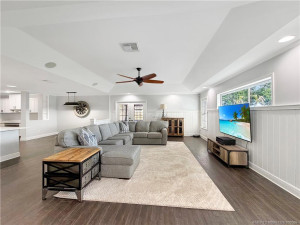 Spacious family room offers comfortable gathering space and an effortless connection to the kitchen and dining areas.