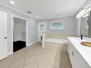 Walk-in closet and door to the patio