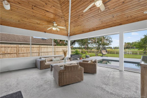 Retractable phantom screen on this delightful patio with wooden ceiling