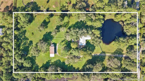 5 newly fenced acres with 3/2 and 3 stall barn.