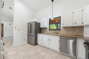 Stainless steel appliances in kitchen.