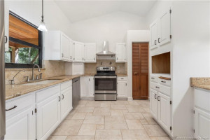 Kitchen has skylight for natural light.