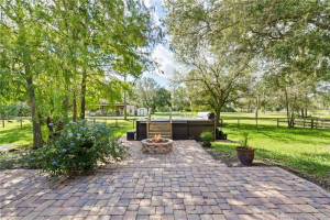Paver patio with fire pit and swim spa.