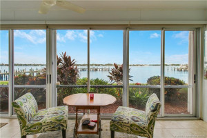 Your front-row seat to paradise! Relax on the enclosed waterfront porch while enjoying spectacular panoramic views of the St. Lucie River, passing boats, and unforgettable Florida sunsets.
