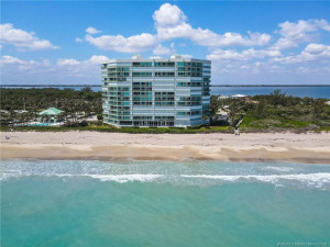 Stunning aerial view of Regency Island Dunes, perfectly positioned along the pristine beaches of Hutchinson Island with the Intracoastal Waterway to the west.