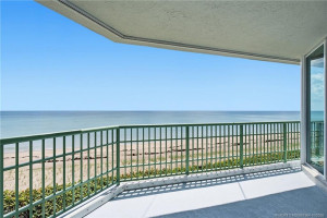 Expansive oceanfront balcony with breathtaking views of the Atlantic Ocean and sandy beach below.