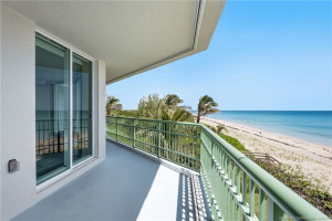 Another view of the wraparound balcony overlooking the pristine shoreline and Atlantic Ocean.