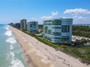 Beautiful perspective of Regency Island Dunes showcasing its direct oceanfront location, expansive sandy beaches, and private beach access.