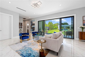 Downstairs Living Room with Patio, Pool, and Guest House Views