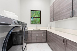 Large Laundry Room with Shelving and Storage