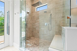 Primary Bathroom Shower and Door to Balcony