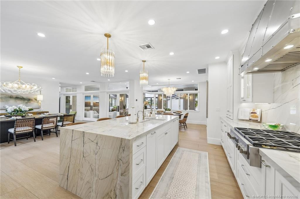 This "show" kitchen is equipped with refrigerator and freezer drawers, sink, Breda dishwasher and Fulgor Milano gas cooktop