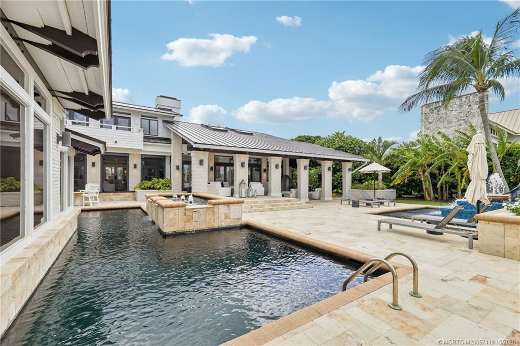 Multiple gathering spaces surround the resort-style pool