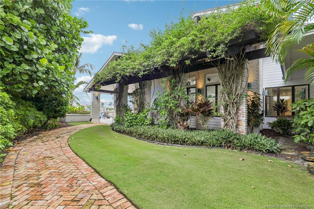 A lovely side yard with brick pathway