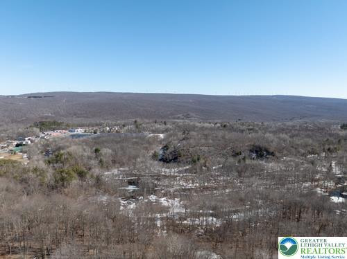 This panoramic view captures the expansive natural beauty of the surrounding landscape. This panoramic view captures the expansive natural