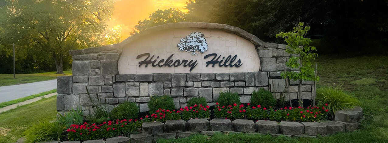 An elegant stone entry monument welcomes residents and guests to the neighborhood. An elegant stone entry monument welcomes residents