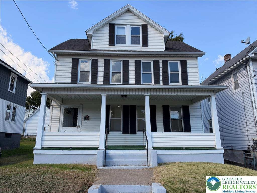 A welcoming front porch with classic columns anchors the facade of this traditional multi-story home. A welcoming front porch with classic columns ancho