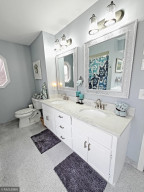 Photo for 11815 61st Avenue N, Plymouth, MN 55442 - Listing #5685157 Main floor master bath has 2 vanities, mirrors and lots of storage space.