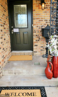 Photo for 11815 61st Avenue N, Plymouth, MN 55442 - Listing #5685157 Front door entry, well lit with substantial awning.