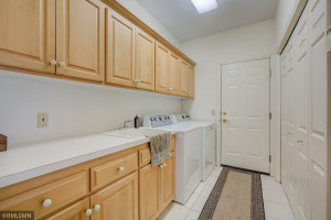 Photo for 4611 Bayswater Road, Excelsior, MN 55331 - Listing #5725865 Main-Level Laundry Room with Maple Cabinets and Large Closet