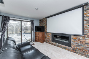Photo for 701 4th Street SW, Austin, MN 55912 - Listing #5731166 Decorative fireplace with walkout to patio/pool