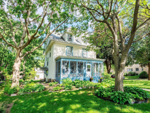 Photo for 3655 Pleasant Avenue, Minneapolis, MN 55409 - Listing #6006077 View of north side of home with a side door. Every inch of the yard is filled with fun and wild life.