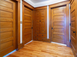 Photo for 3655 Pleasant Avenue, Minneapolis, MN 55409 - Listing #6006077 Second floor landing shows all the beautiful solid wood doors and deep built-in linen closet. Door on the right leads up to the 900sqft. unfinished walk up attic. Could be an amazing master suit with cathedral ceilings.