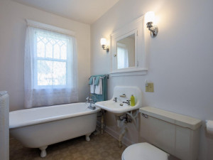 Photo for 3655 Pleasant Avenue, Minneapolis, MN 55409 - Listing #6006077 Upper level full bath. Claw foot tub and sink recently resurfaced. Also, has a built-in linen closet and medicine cabinet.