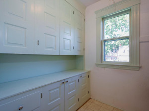 Photo for 3655 Pleasant Avenue, Minneapolis, MN 55409 - Listing #6006077 Walk-in Pantry has plenty of storage. Solid wood cabinets. Wood shelving on opposite side.