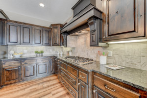 Photo for 5173 Suntide Pass, Woodbury, MN 55129 - Listing #6006439 One-of-a-kind knotty Alder cabinets with a hidden spice rack!