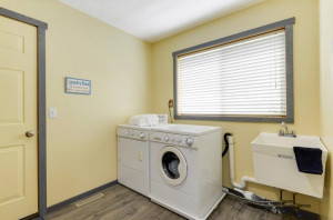 Photo for 9917 Linden Avenue N, Brooklyn Park, MN 55443 - Listing #6017482 An 8x8 large laundry room in the back entry on main from the garage is so adorable! Plenty of room for the boot tray and a huge coat closet for coats and more!