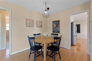 Photo for 4753 Abbott Avenue S, Minneapolis, MN 55410 - Listing #6028078 Dining area with hardwood floors and newer light fixture