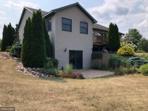 Photo for 995 166th Street, Hammond, WI - Listing #6025606 Walkout is great to enjoy patio views of the landscaped lawn and seasonal creek.