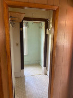 Photo for 100 Zenith Street, Lanesboro, MN 55949 - Listing #6071106 Closet for Coats-Shoes and entry for basement steps in back