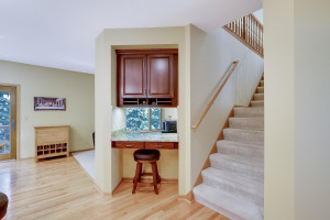 Photo for 3600 Alvarado Lane N, Plymouth, MN 55446 - Listing #6014595 Dual stairs from kitchen leads to the upper level. Small desk and cabinetry to organize home and family is located in this nook.