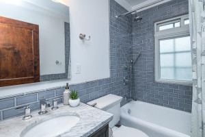Photo for 615 8th Avenue SW, Rochester, MN 55902 - Listing #5748504 Upper level full bath with classy subway tile surround.