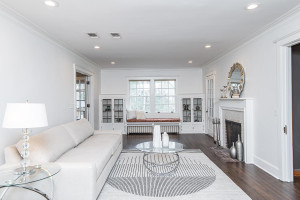 Photo for 615 8th Avenue SW, Rochester, MN 55902 - Listing #5748504 Amazing living room with crown moulding, recessed lighting, window bench, fireplace, hardwood flooring, and built-ins!