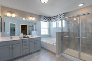 Photo for 12292 62nd Street NE, Otsego, MN 55301 - Listing #6112849 An extension of the primary suite, this private and spacious bathroom contains a double-vanity, a separate shower and tub, a private water closet, plus two walk-in closets. *pictures are of model home, actual colors may vary.