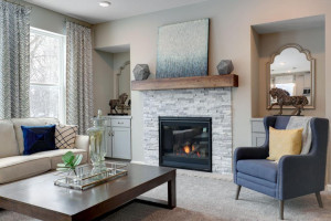 Photo for 12292 62nd Street NE, Otsego, MN 55301 - Listing #6112849 Gas fireplace with mantle, surround and base cabinets provide a visual beauty to accent the family room. *pictures are of model home, actual colors may vary.