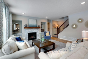 Photo for 12292 62nd Street NE, Otsego, MN 55301 - Listing #6112849 The home's main level family room features a natural gas fireplace and matching built-in entertainment cabinets. *pictures are of model home, actual colors may vary.