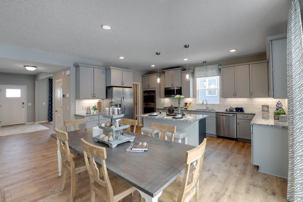 Photo for 12292 62nd Street NE, Otsego, MN 55301 - Listing #6112849 The open layout provides an optimal area to cook and entertain. Envision gathering together in the heart of this home. *pictures are of model home, actual colors may vary.