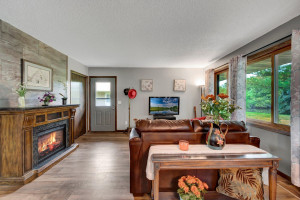 Photo for 5305 72nd Circle N, Brooklyn Park, MN 55429 - Listing #6114047 The Welcoming Entry Leads to the Living Room with it's Large South Facing Windows at Right and Moveable Electric Fireplace at Left. Notice the 24 x 12 Inch Accent Wall Tiles and Luxury Plank Flooring, Both New June 2021.